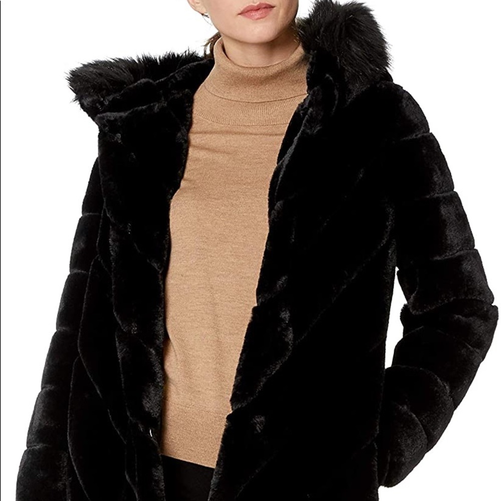 Brand new, never worn Calvin Klein faux fur coat.